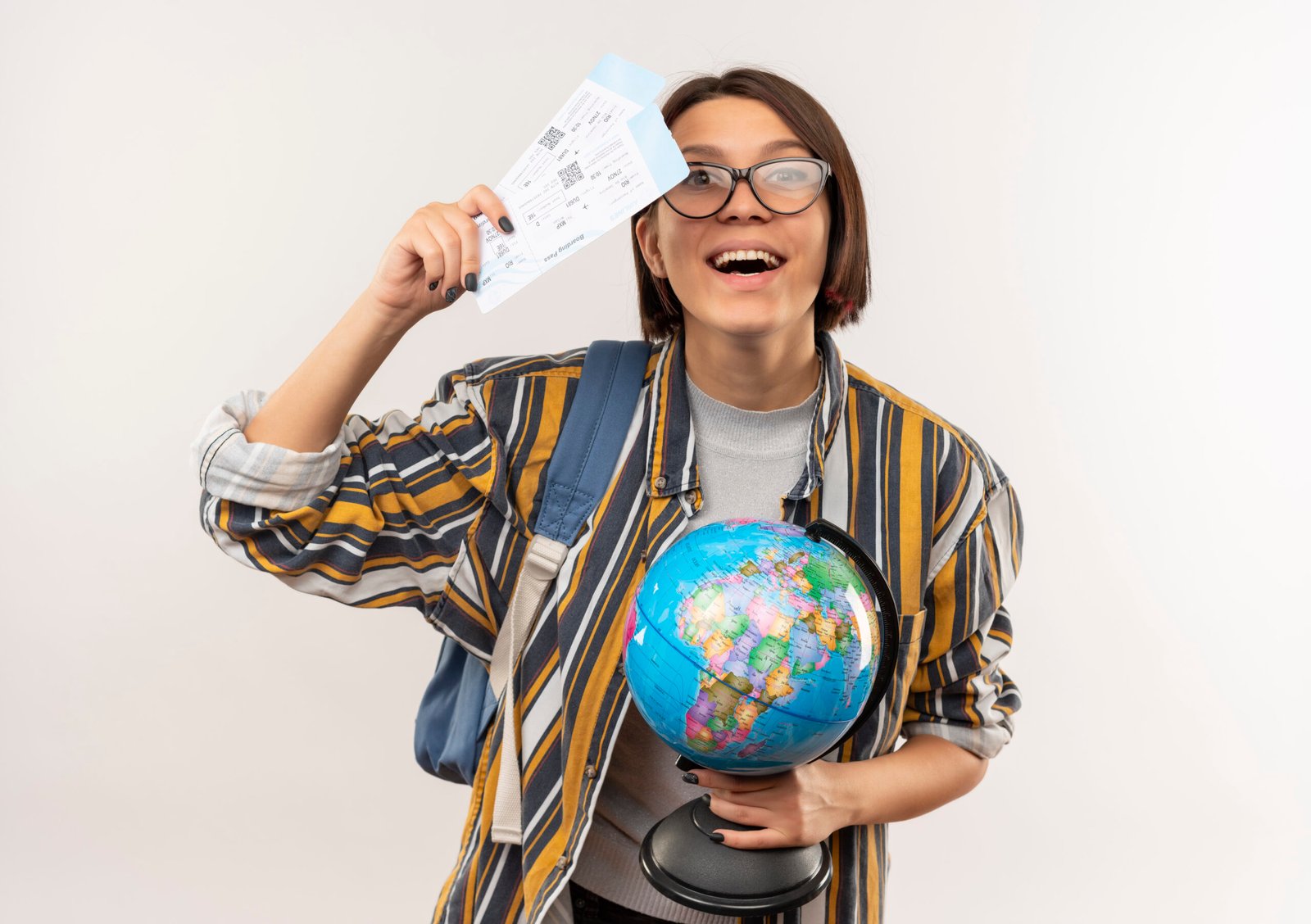 joyful young student girl wearing glasses and back bag holding airplane tickets and globe isolated on white background